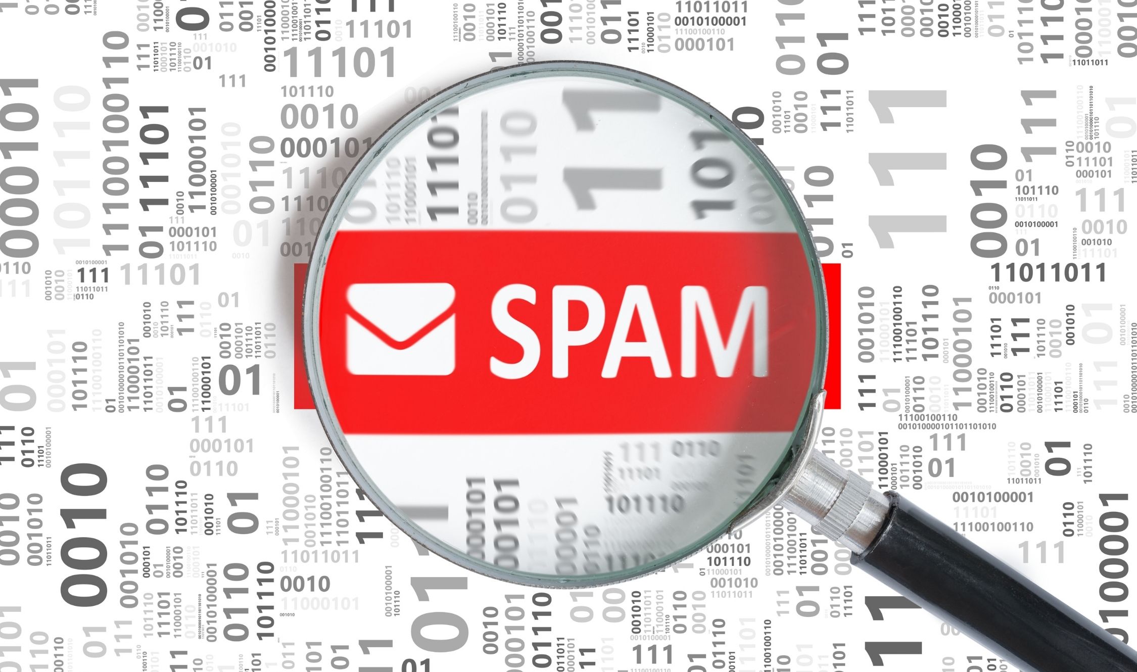 lente ingrandimento con scritta spam e codice